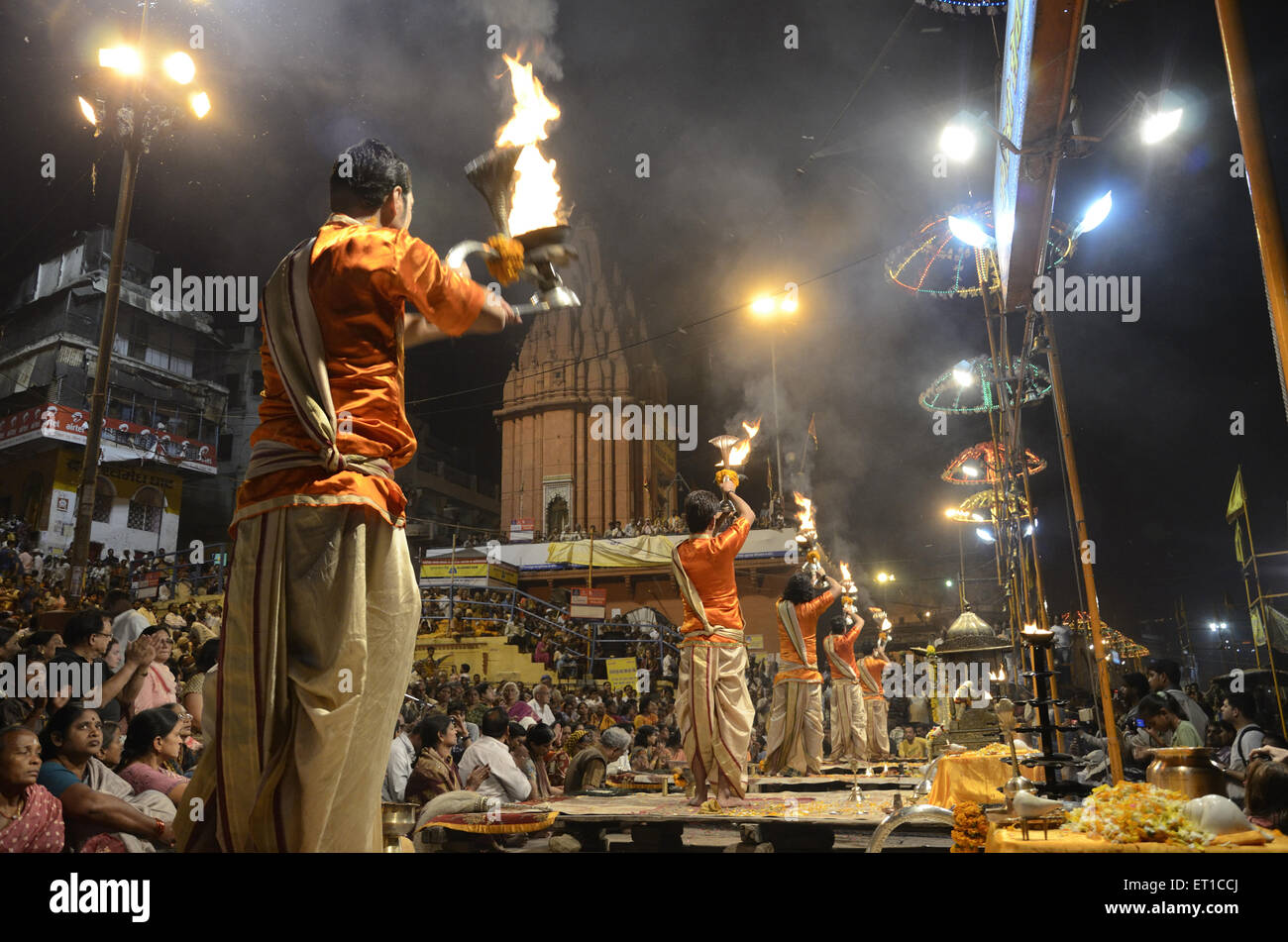 priests performing pooja on Varanasi ghat at Uttar Pradesh India Stock Photo