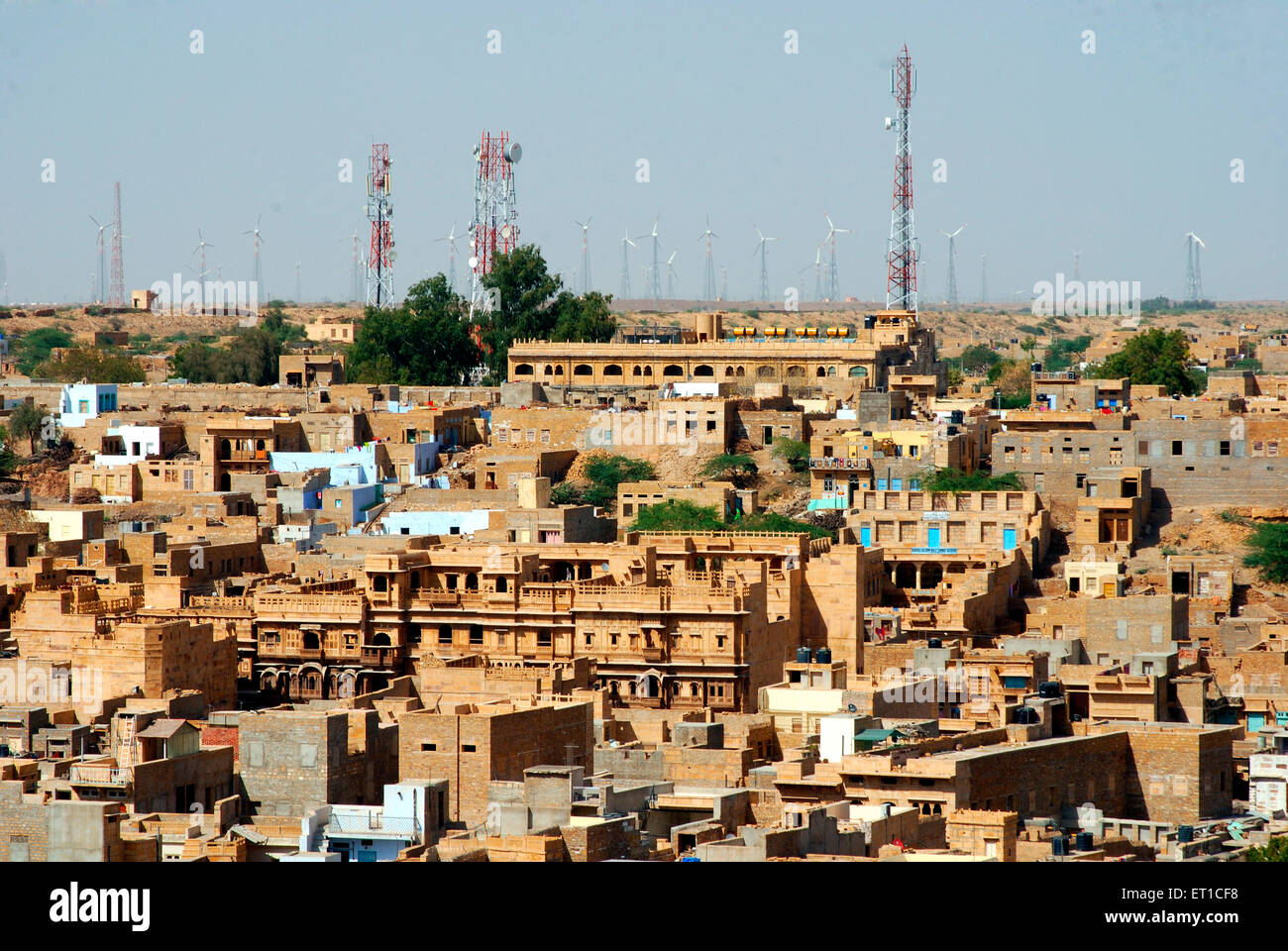 Jaisalmer city ; windmills in backdrop ; Jaisalmer ; Rajasthan ; India Stock Photo