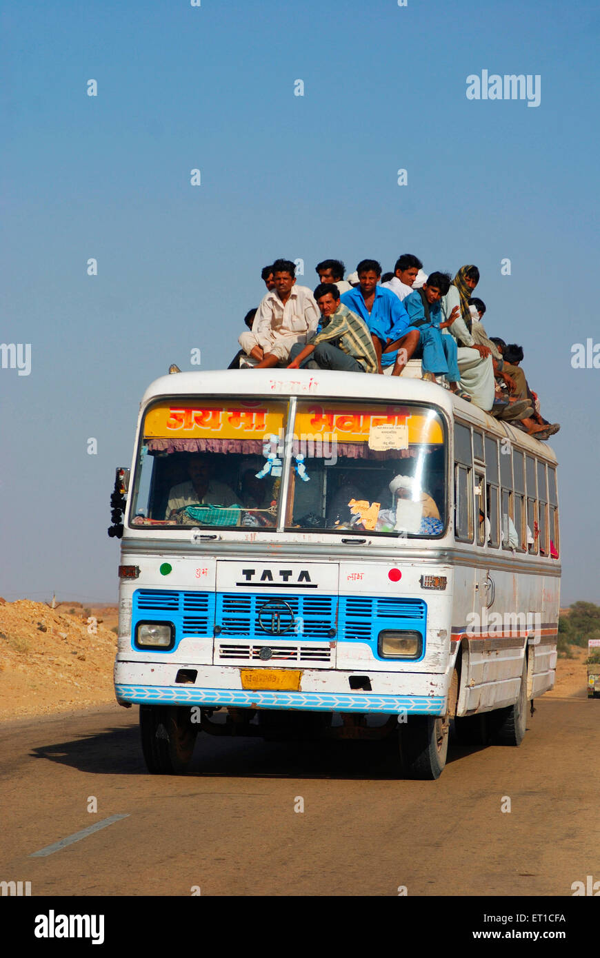Indian people sitting on roof of bus Jaisalmer Rajasthan India Asia ...