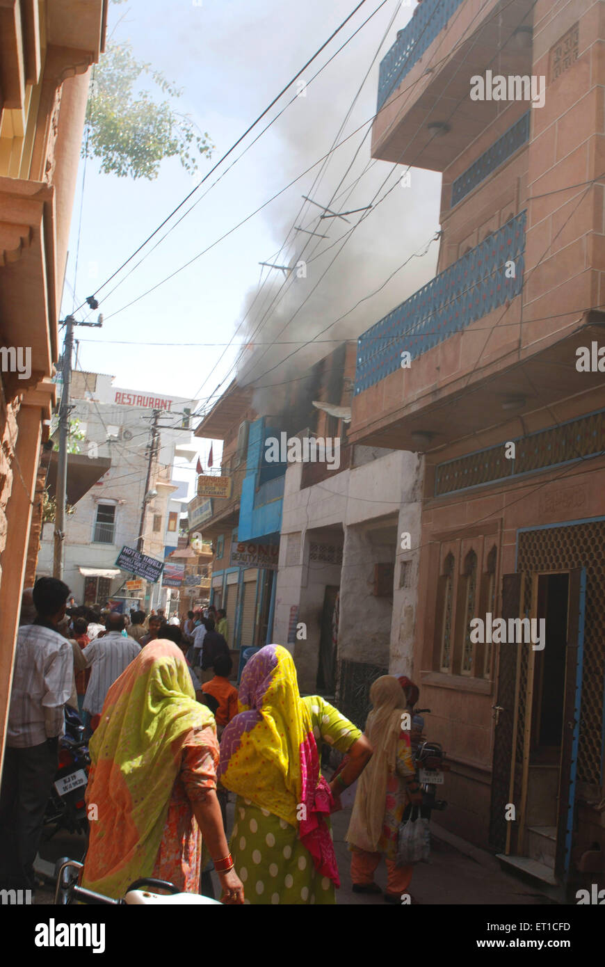 People watching fire victim house in lane ; Jodhpur ; Rajasthan ; India Stock Photo