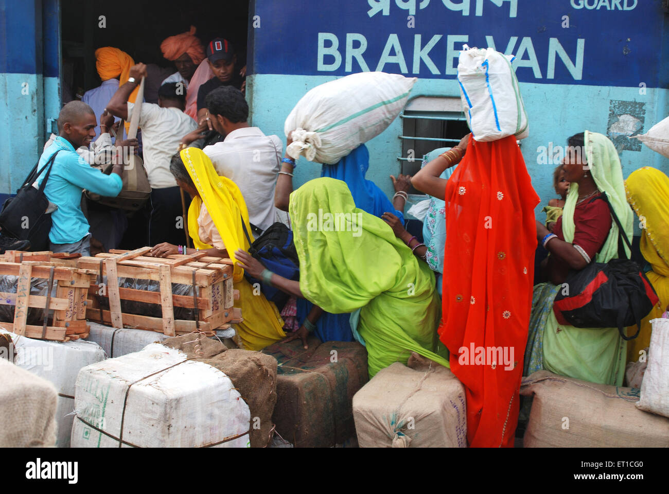 Commuters trying to enter into brakevan of train ; Jodhpur ; Rajasthan ; India Stock Photo