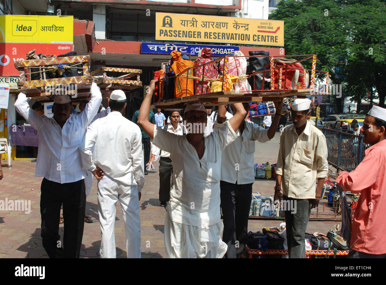Dabbawala carrying lunchboxes in  tray at churchgate station ; Bombay Mumbai ; Maharashtra ; India NO MR Stock Photo