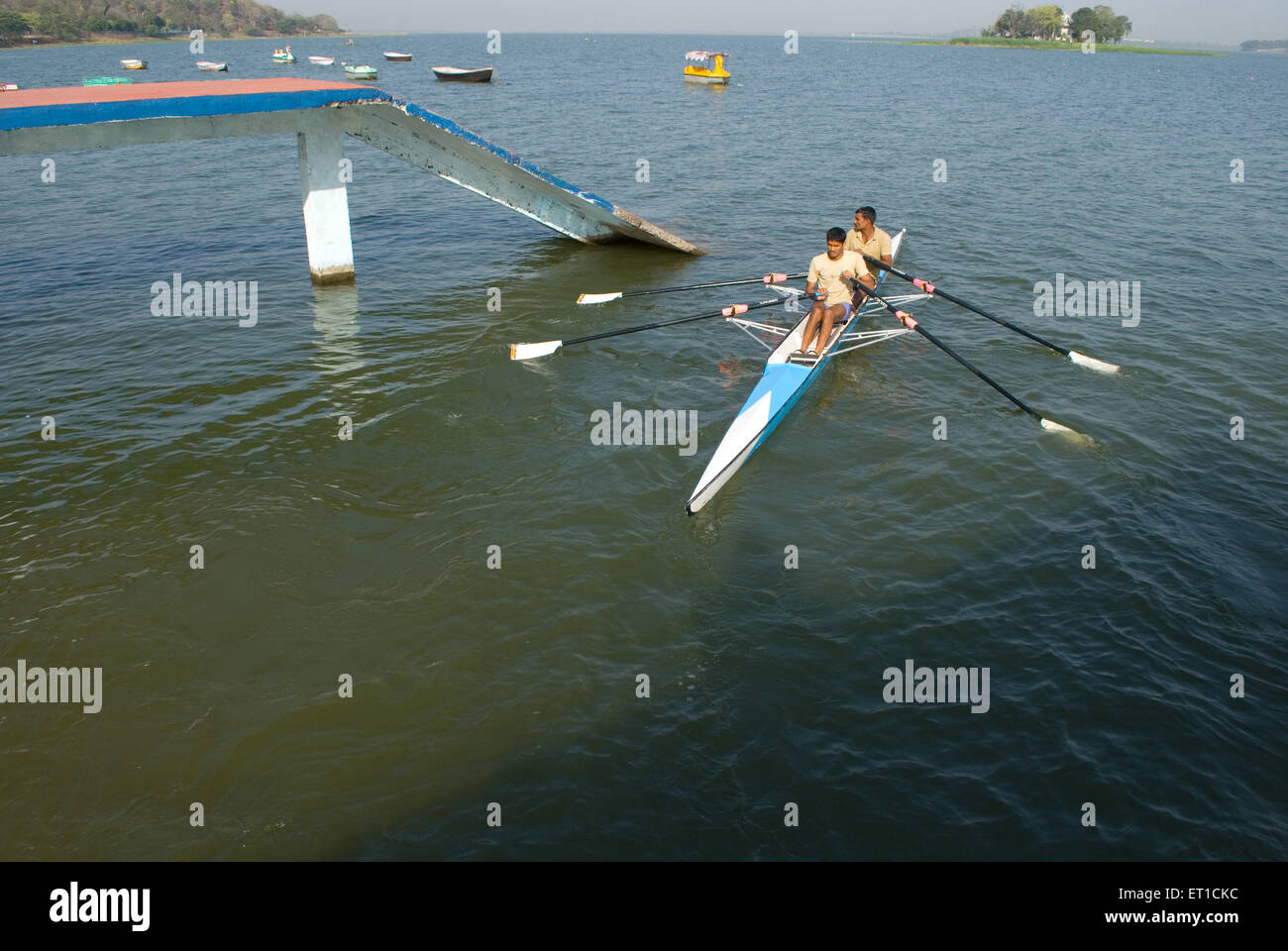 Men in canoe in taal lake ; Bhopal ; Madhya Pradesh ; India Stock Photo