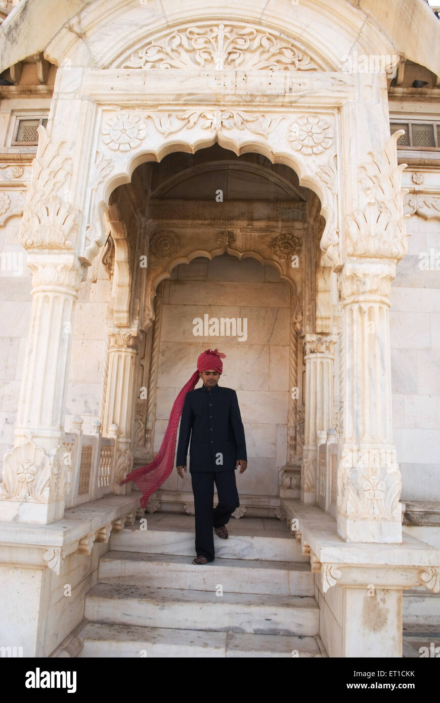 Tourist guide standing on stair of jaswant thada ; Jodhpur ; Rajasthan ; India MR#704F Stock Photo