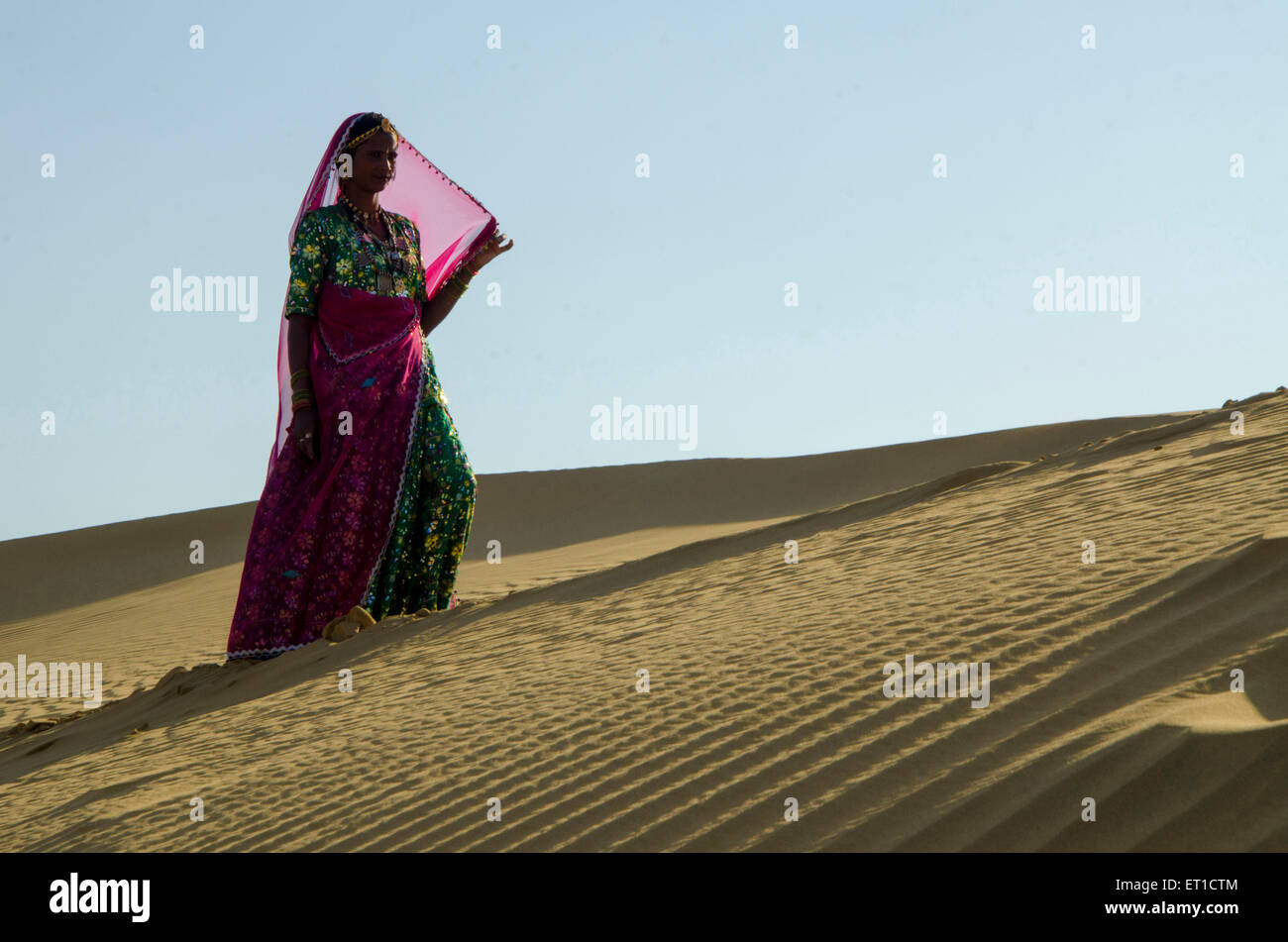 Woman Walking on Sam Sand Dune Thar Desert Jaisalmer Rajasthan India Asia MR # 704 Stock Photo