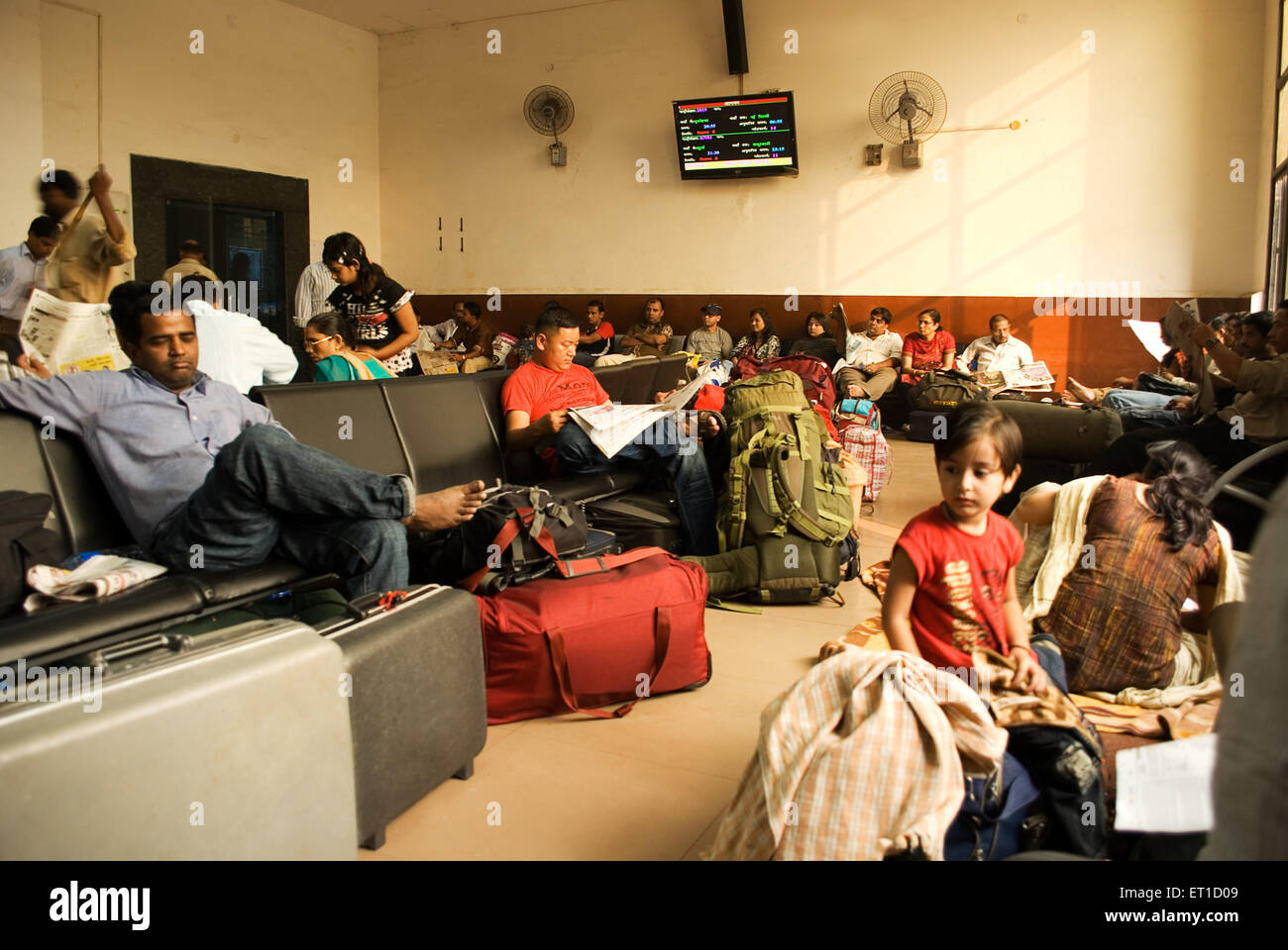 People sitting in waiting room, Railway Station, New Delhi, India, Asia Stock Photo