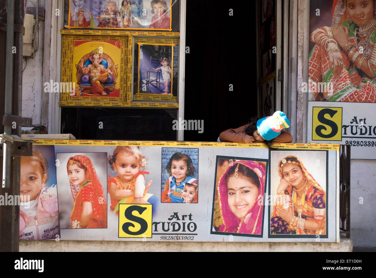 A little girl taking nap in photo studio ; Jodhpur ; Rajasthan ; India Stock Photo