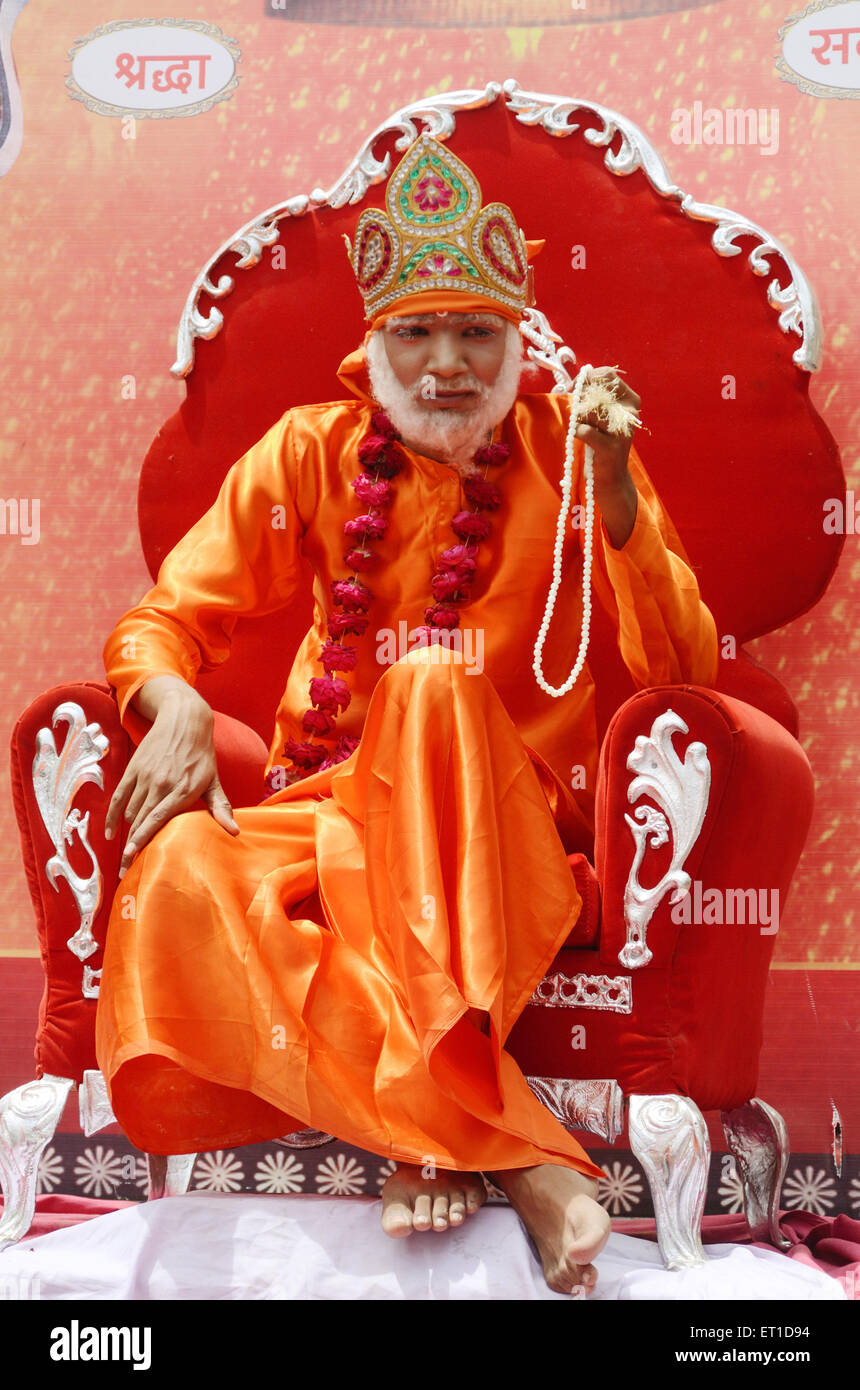 Man in disguise of Sai Baba in procession of Ramnavami Jodhpur Rajasthan India Asia Stock Photo