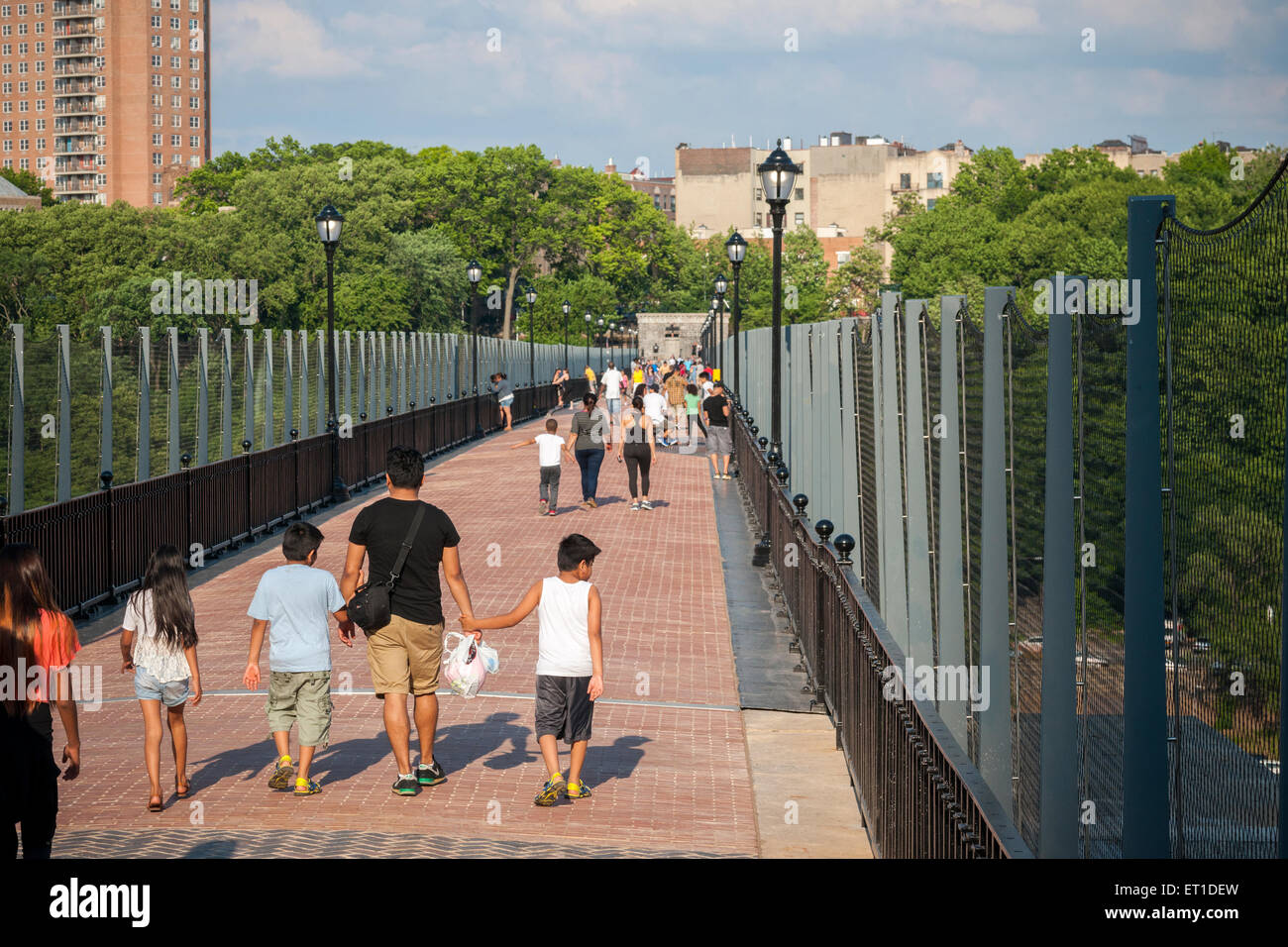 Excited visitors walk and bike over the newly opened reconstructed High Bridge connecting the Bronx to Upper Manhattan over the Harlem River in New York on Tuesday, June 9, 2015. The pedestrian bridge, the oldest bridge in New York, has been closed since the 1970's and was part of the Croton Aqueduct system until 1917, supplying water to New York.  (© Richard B. Levine) Stock Photo