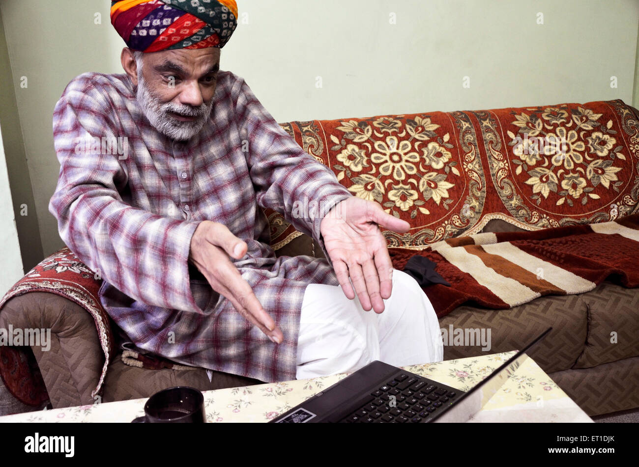 rural man turban laptop surprise Jodhpur Rajasthan India Asia MR#704 Stock Photo