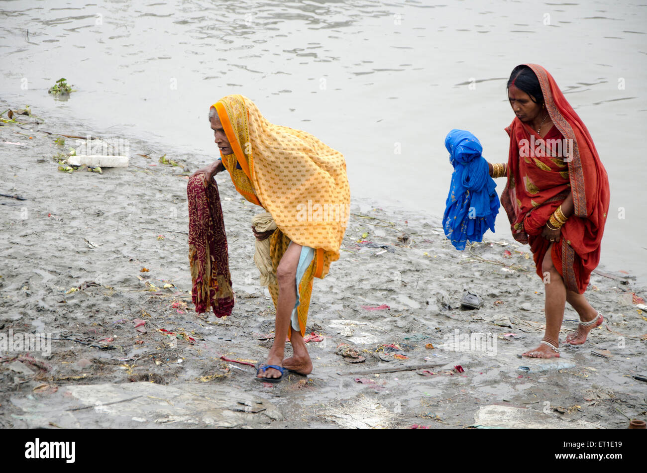 women after holy dip in Hooghly river Kolkata West Bengal India Asia Stock Photo