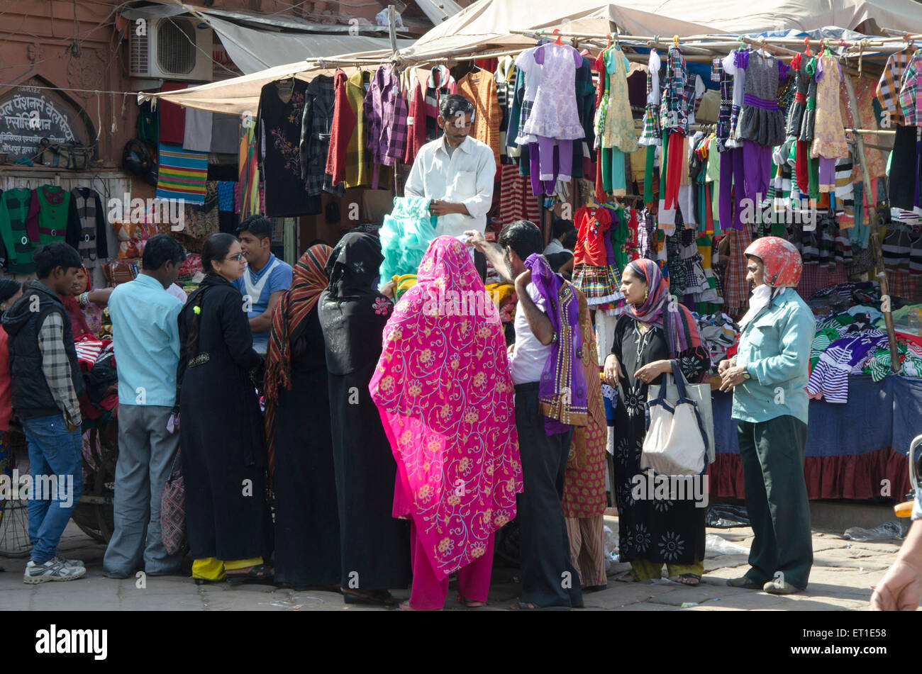 Ladies buying clothes Clock Tower Market Jodhpur Rajasthan India Asia Stock Photo