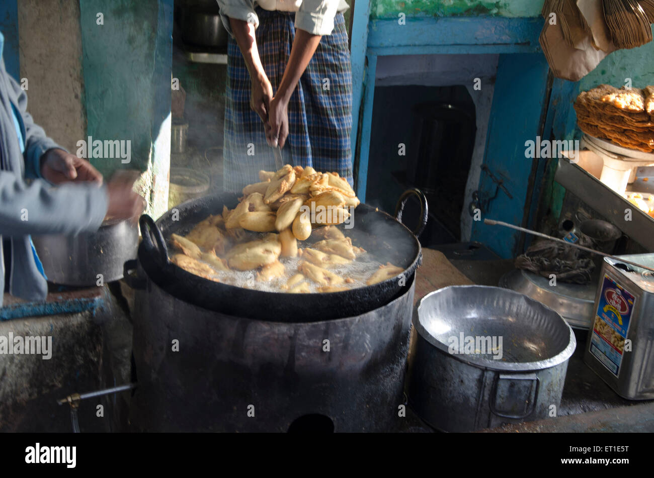 worker frying Mirchi vada in oil Bikaner Rajasthan India Asia Stock Photo