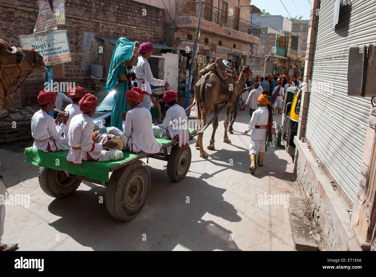 Folk artists sitting on camel cart Jodhpur Rajasthan India Asia Stock Photo