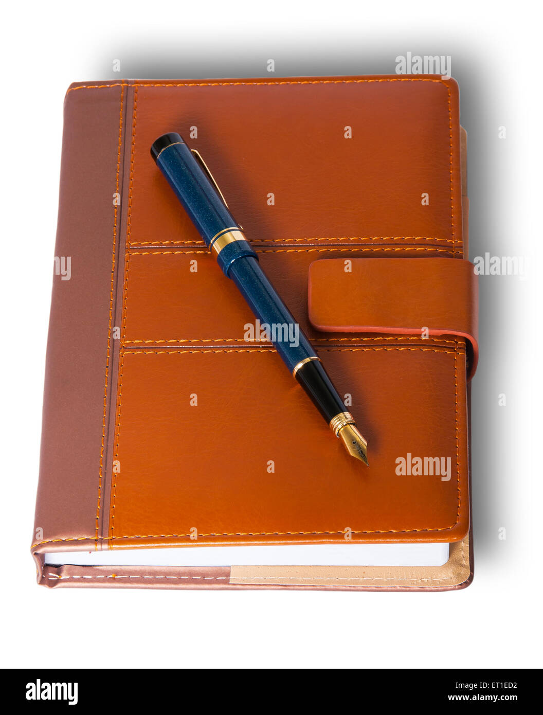 Fountain pen on top of the closed notebook isolated on white background Stock Photo
