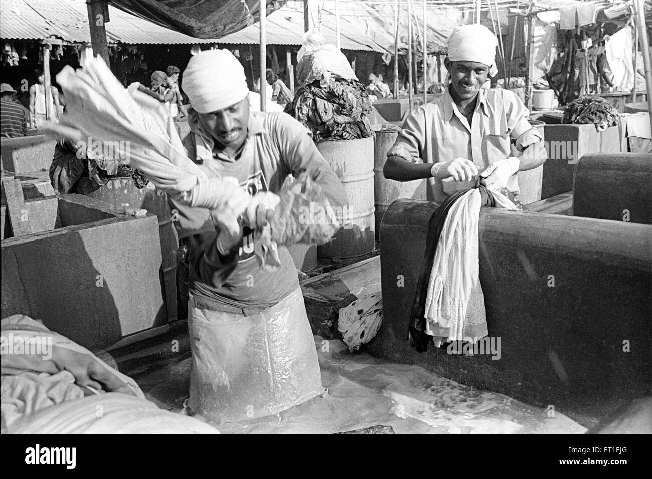 Washer men at Dhobi ghat ; Mahalaxmi ; Bombay Mumbai ; Maharashtra ; India Stock Photo