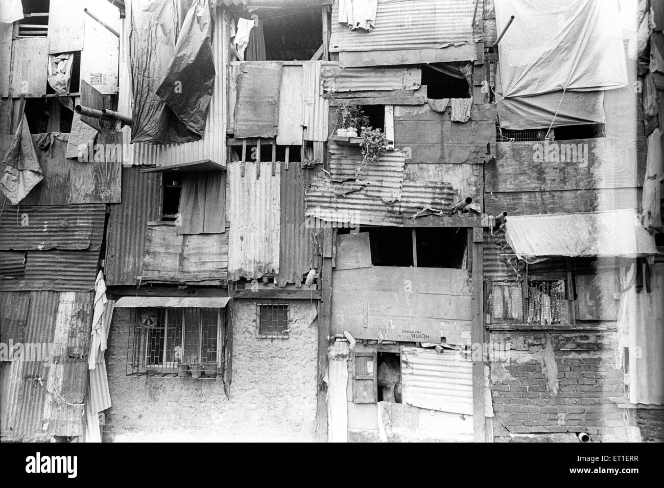 Slum makeshift houses at Bandra Station Bombay Mumbai Maharashtra India Indian slums Stock Photo