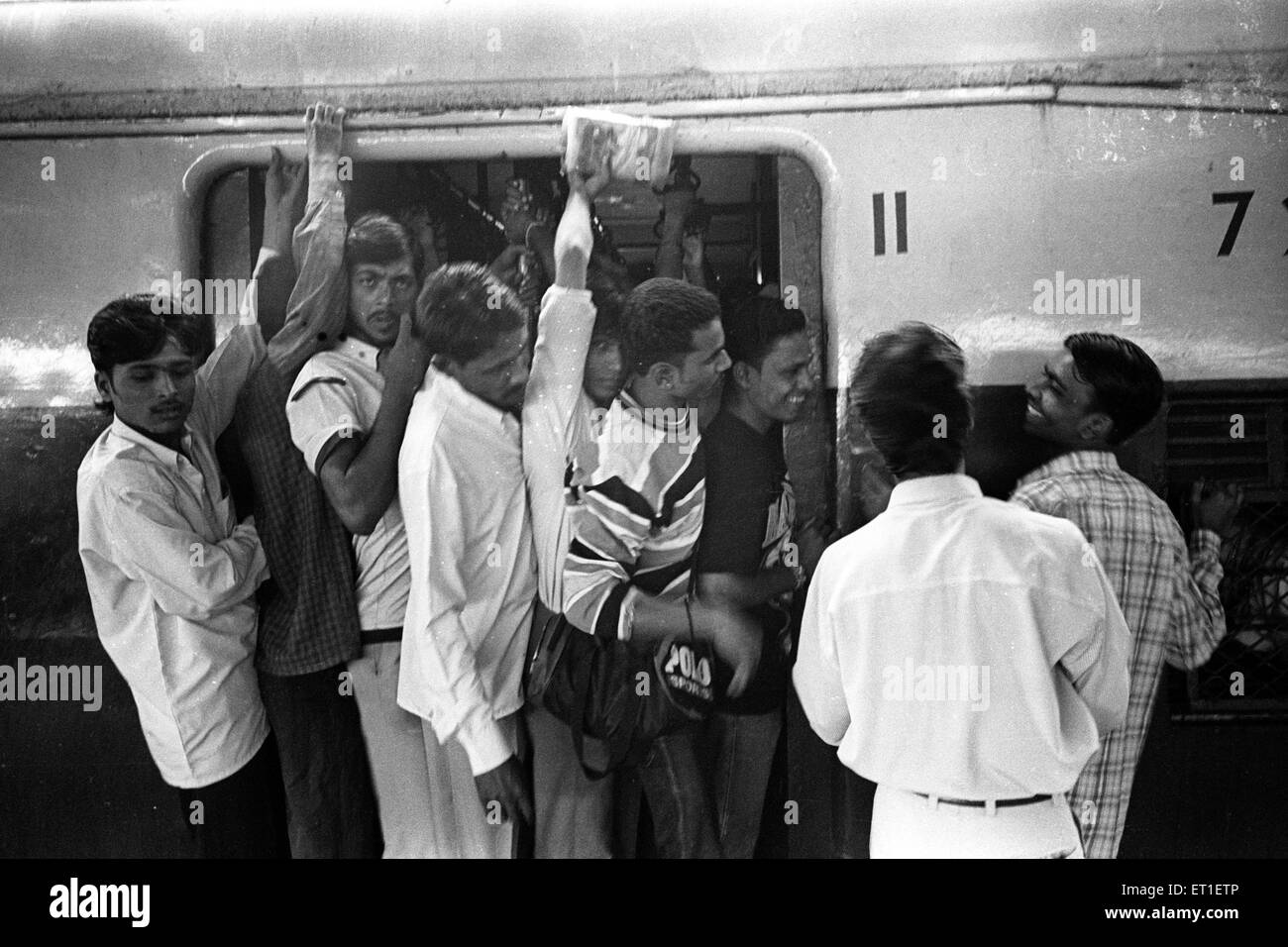 Crowded local train ; Bombay Mumbai ; Maharashtra ; India Stock Photo