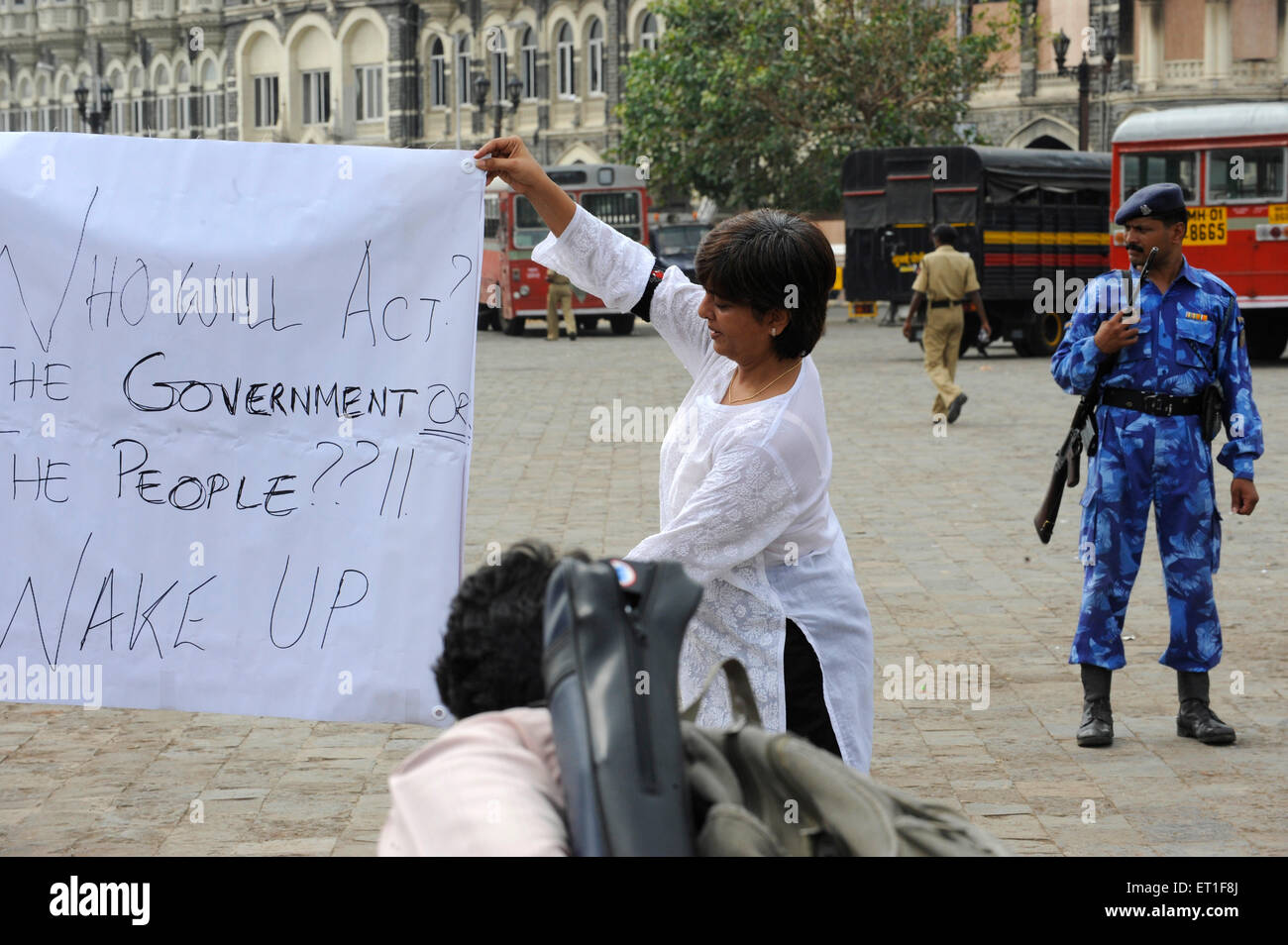 Protestor banner  Taj Mahal hotel ; after terrorist attack by Deccan Mujahedeen on 26th November 2008 in Bombay Stock Photo
