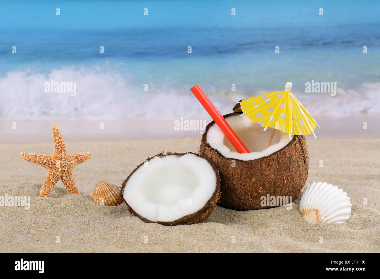 Coconut fruit cocktail drink in summer on the beach and sea with copyspace Stock Photo
