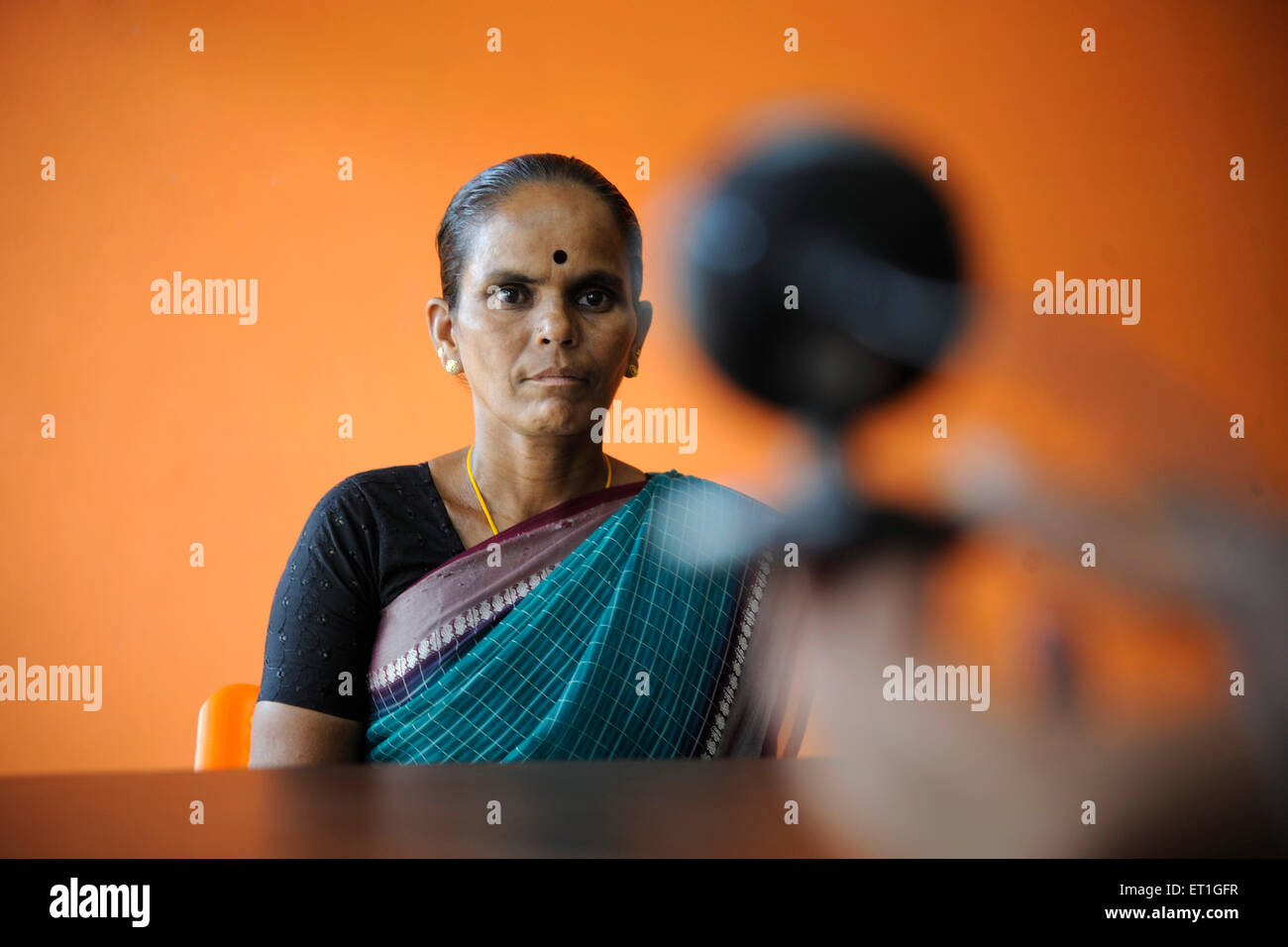 Taking photo of rural lady bank identity, Kshetriya Gramin Financial Services, NGO, IFMR Foundation, Tanjore, Thanjavur, Tamil Nadu, India, Asia, Stock Photo