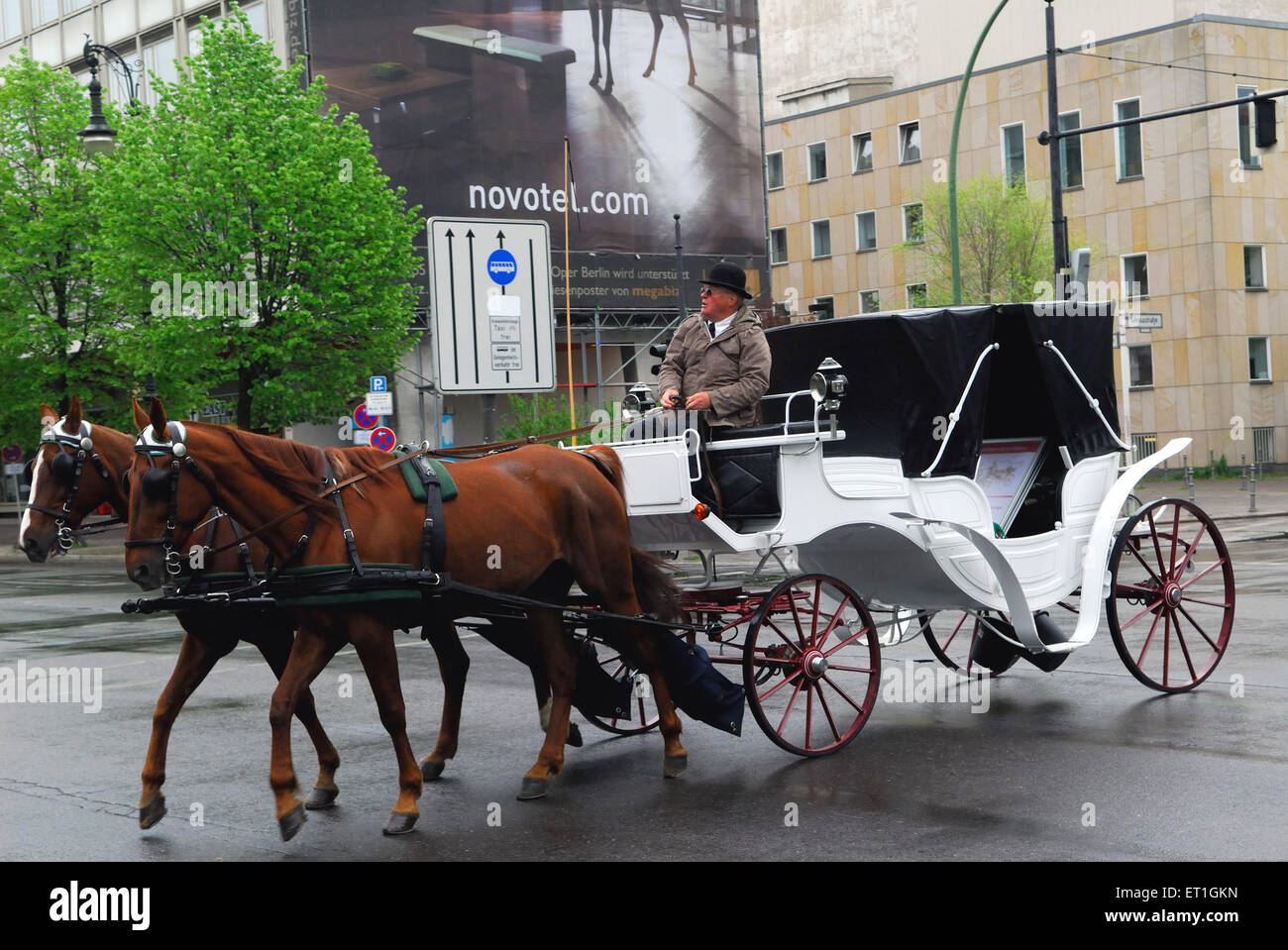Old fashioned horse driven carriages still running on streets ; Germany Stock Photo