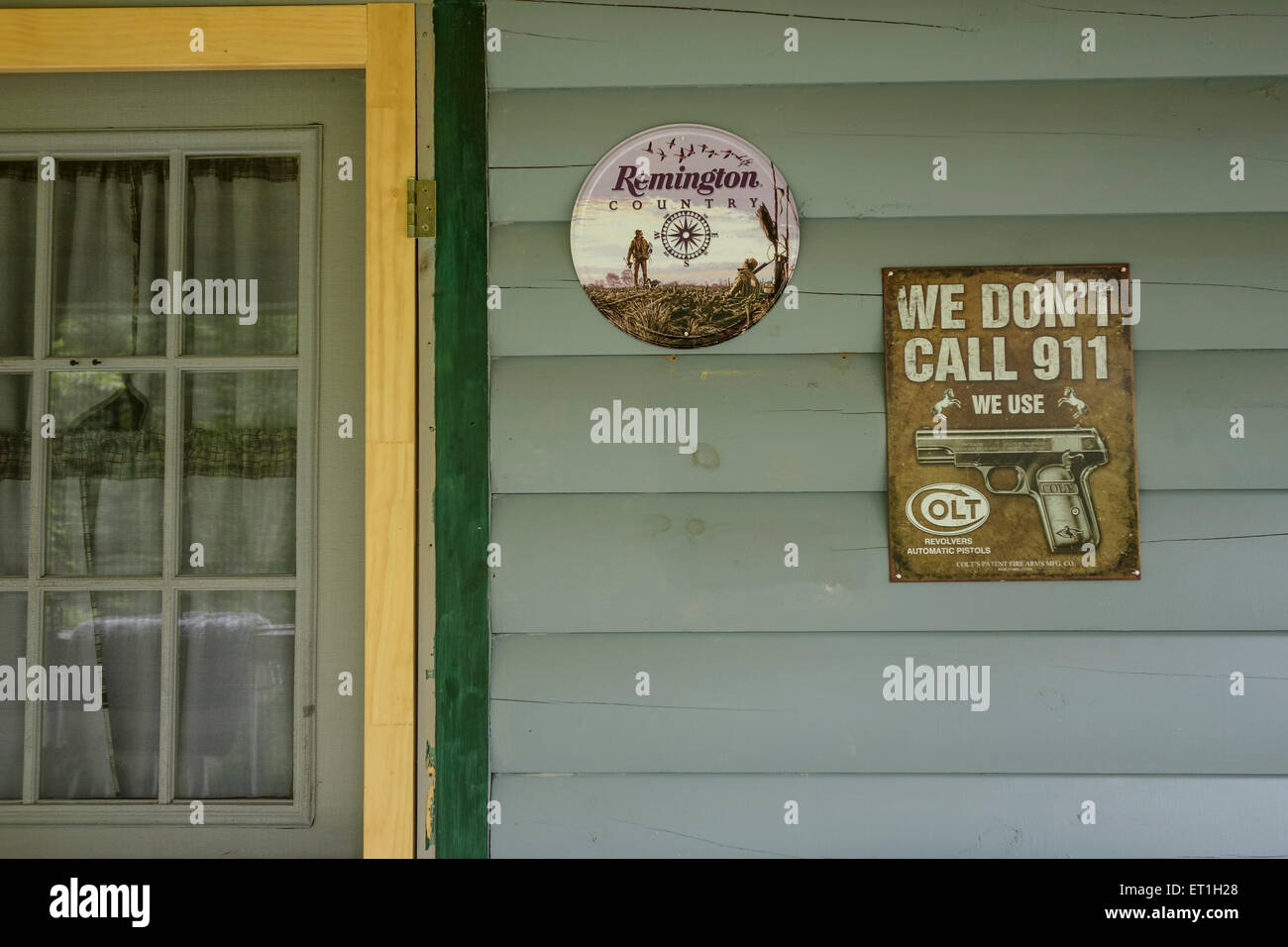 Pro-Gun Control, sign on forest cabin, Second Amendment, USA. Stock Photo