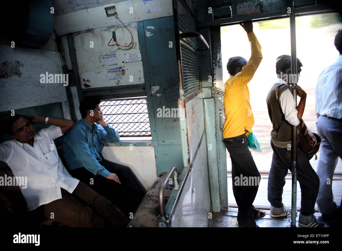 people in local train compartment, Bombay, Mumbai, Maharashtra, India, Asia, Asian, Indian Stock Photo