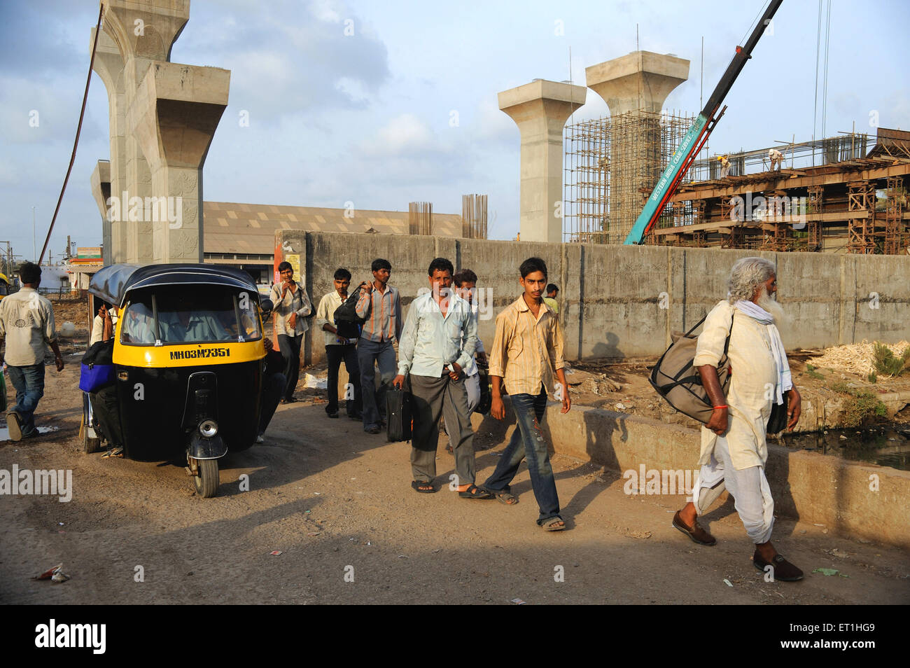 Pedestrian from construction site of bridge ; Bombay Mumbai ; Maharashtra ; India Stock Photo
