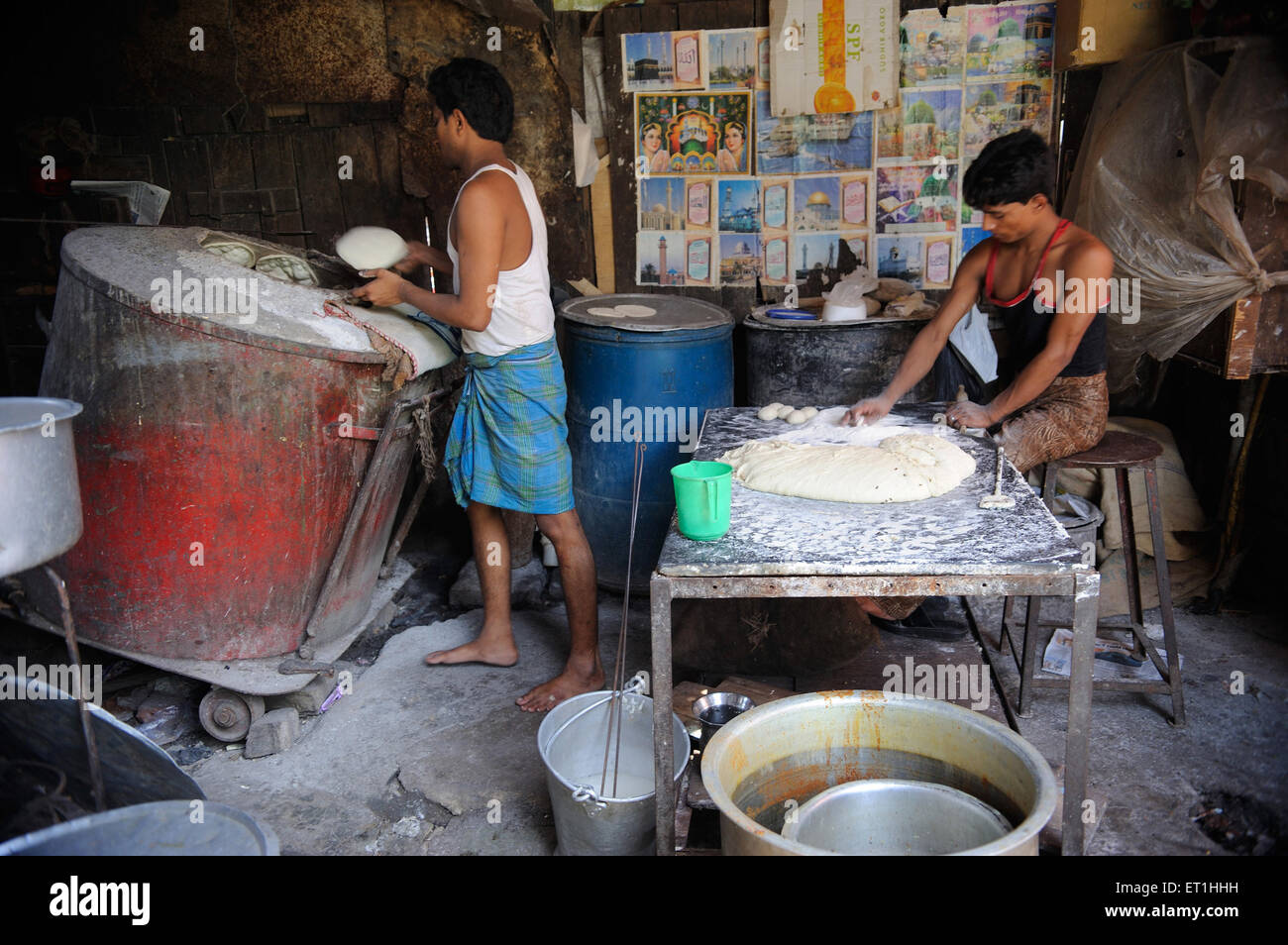 Man making tandoori roti in kitchen ; Bombay Mumbai ; Maharashtra ; India NO MR Stock Photo