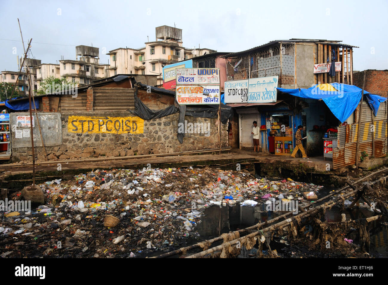 Open gutter outside slum Bombay Mumbai ; Maharashtra ; India Stock Photo
