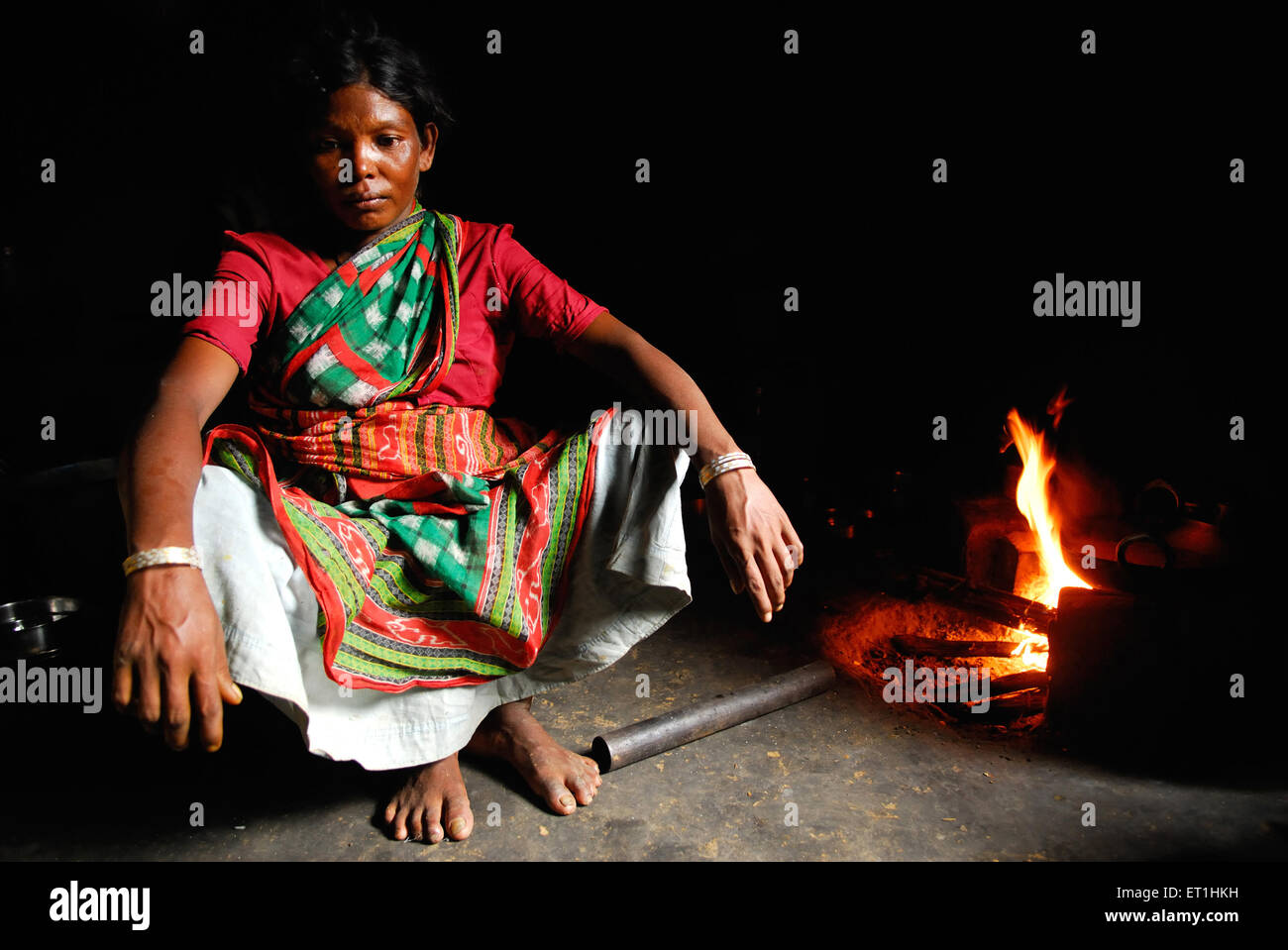 Ho tribes tribal woman cooking with wood coal ; Chakradharpur ;  Jharkhand ; India Stock Photo