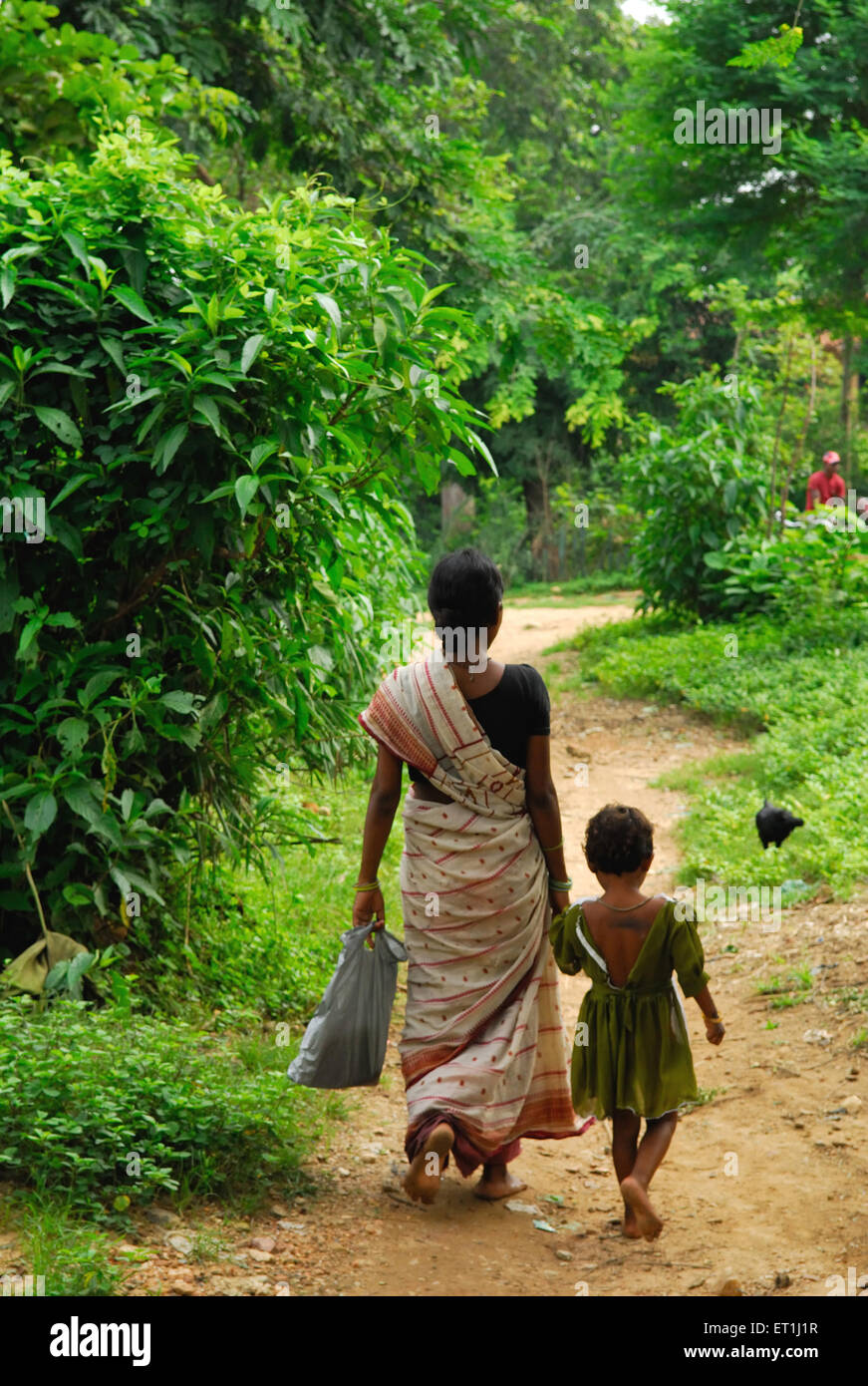 Ho tribes mother and daughter walking ; Chakradharpur ; Jharkhand ; India NO MR Stock Photo
