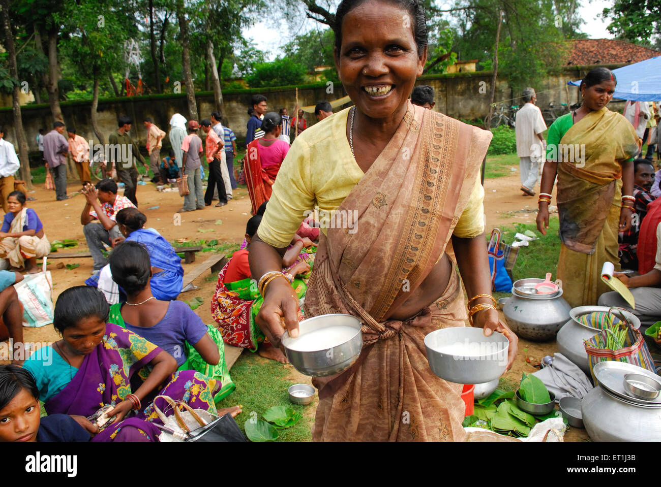 Ho tribes woman selling milk in market ; Chakradharpur ; Jharkhand ; India NO MR Stock Photo