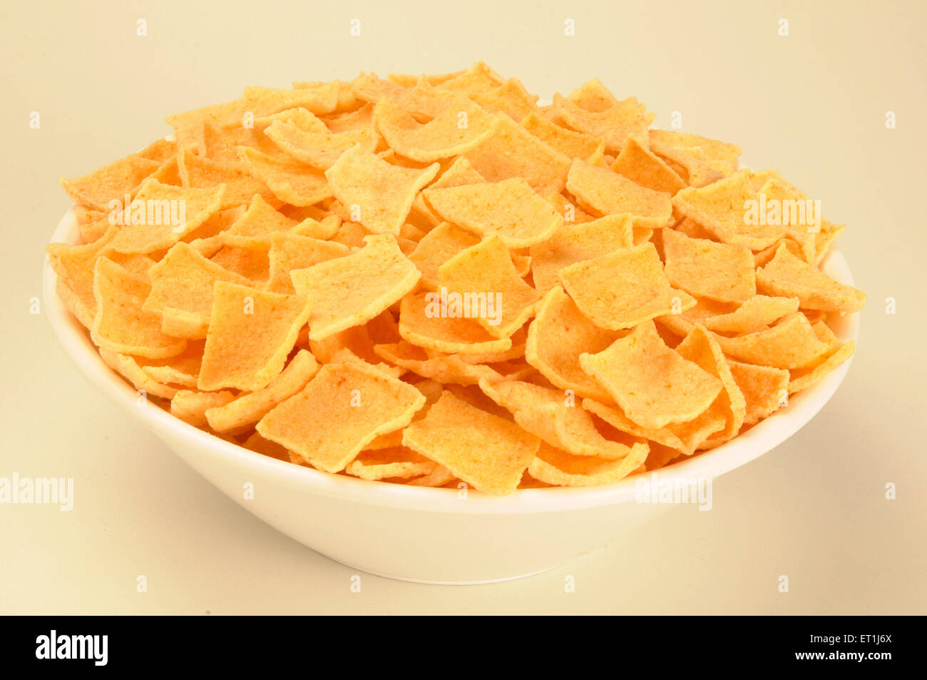 Snacks ; papad in white bowl on white background 23 May 2008 Stock Photo