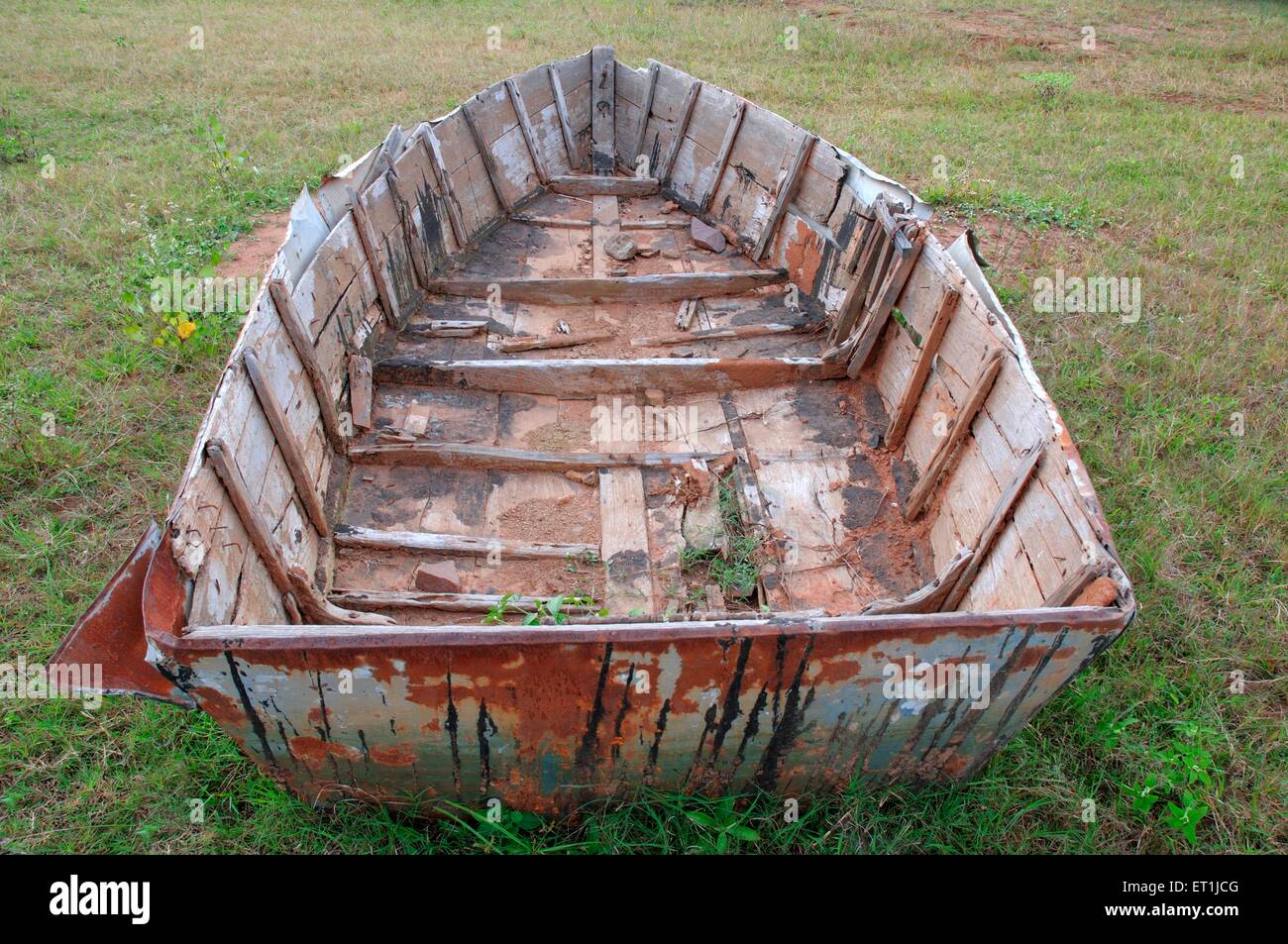 old wooden dilapidated damaged broken wrecked abandoned boat ; Pachmarhi ; Madhya Pradesh ; India Stock Photo