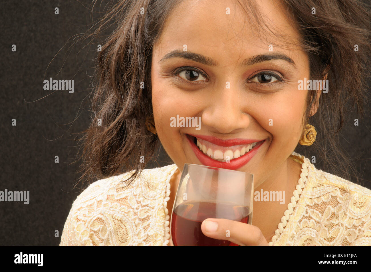 girl sipping glass of red wine   Model Released # 671 Stock Photo