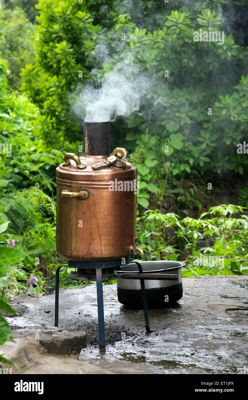 antique vintage copper coal fired water heater boiler ; Kondhanpur ; Pune ; Maharashtra ; India Stock Photo