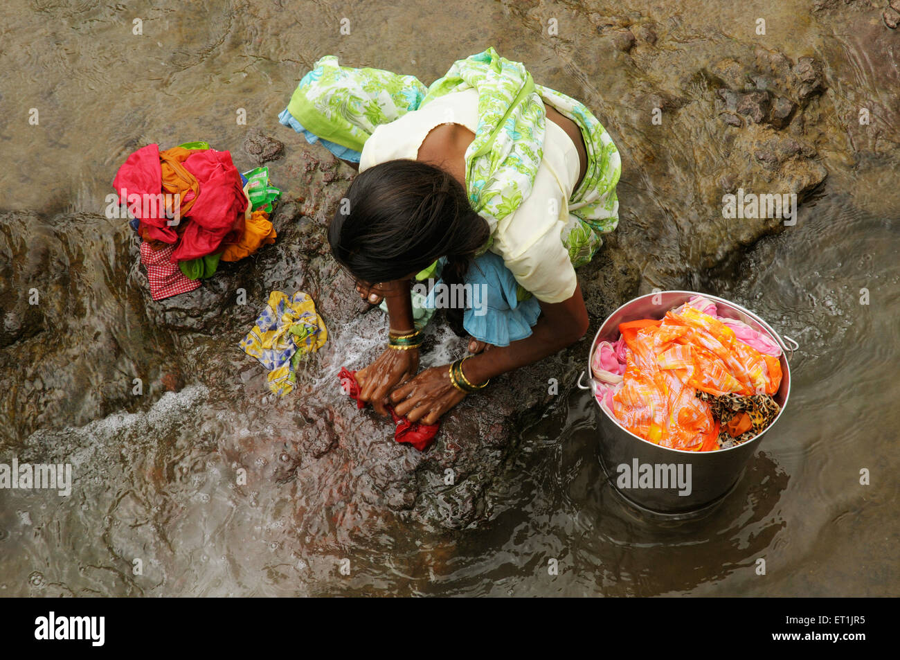 woman washing clothes garment apparel laundry ; Kondhanpur ; Pune ; Maharashtra ; India Stock Photo