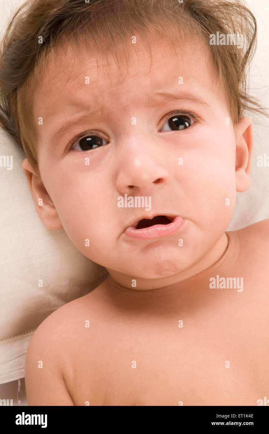Baby Lying and Crying Pune Maharashtra India Asia Oct 2010 MR#686 U Stock Photo