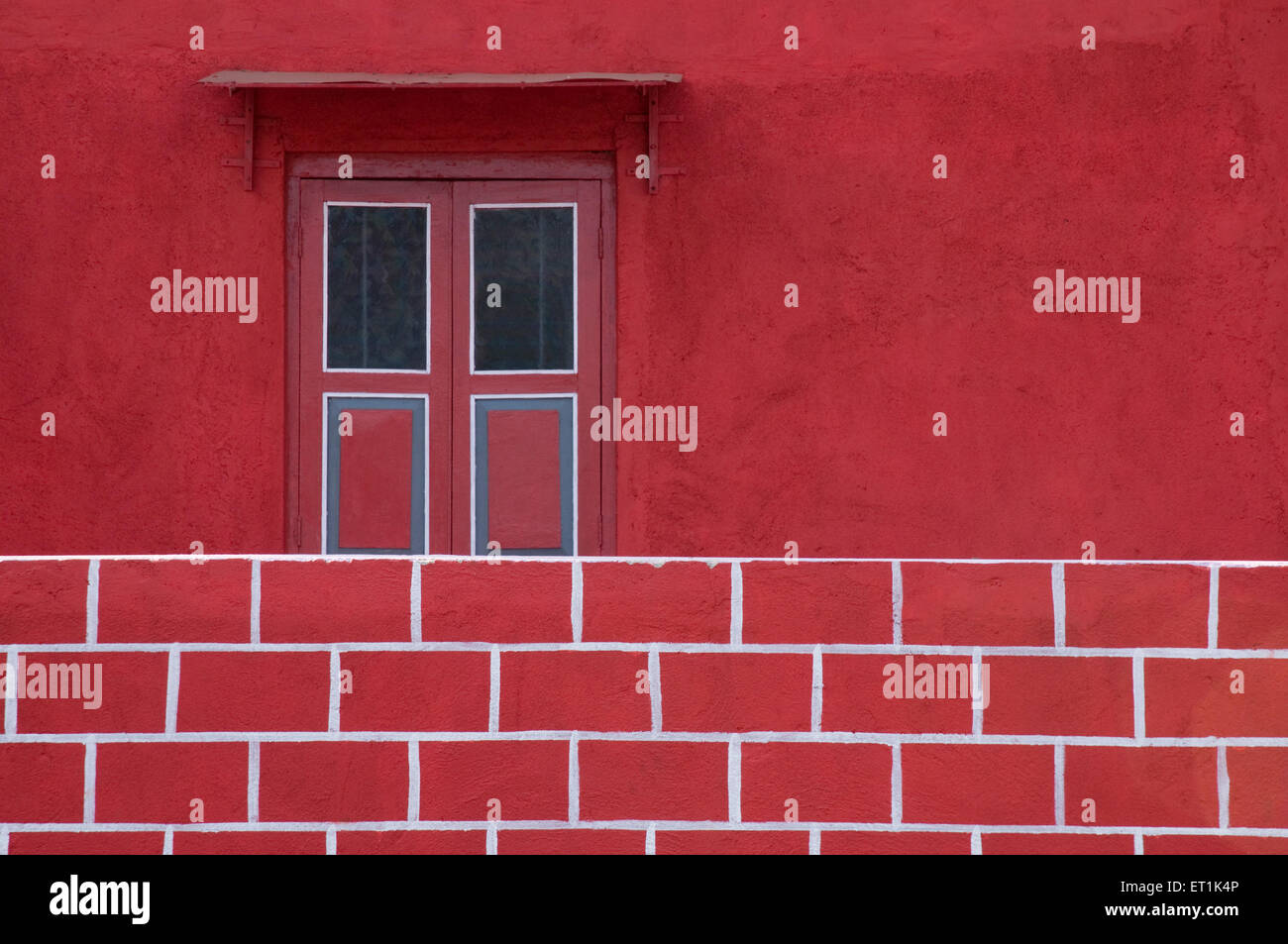 Red house wall window bricks, Divyagar, Maharashtra, India, Asia, Asian, Indian Stock Photo