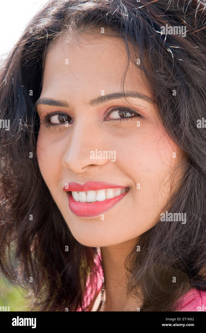 Lady Smiling with Tousled hair Pune Maharashtra India Asia Jan 2011MR#686 W Stock Photo