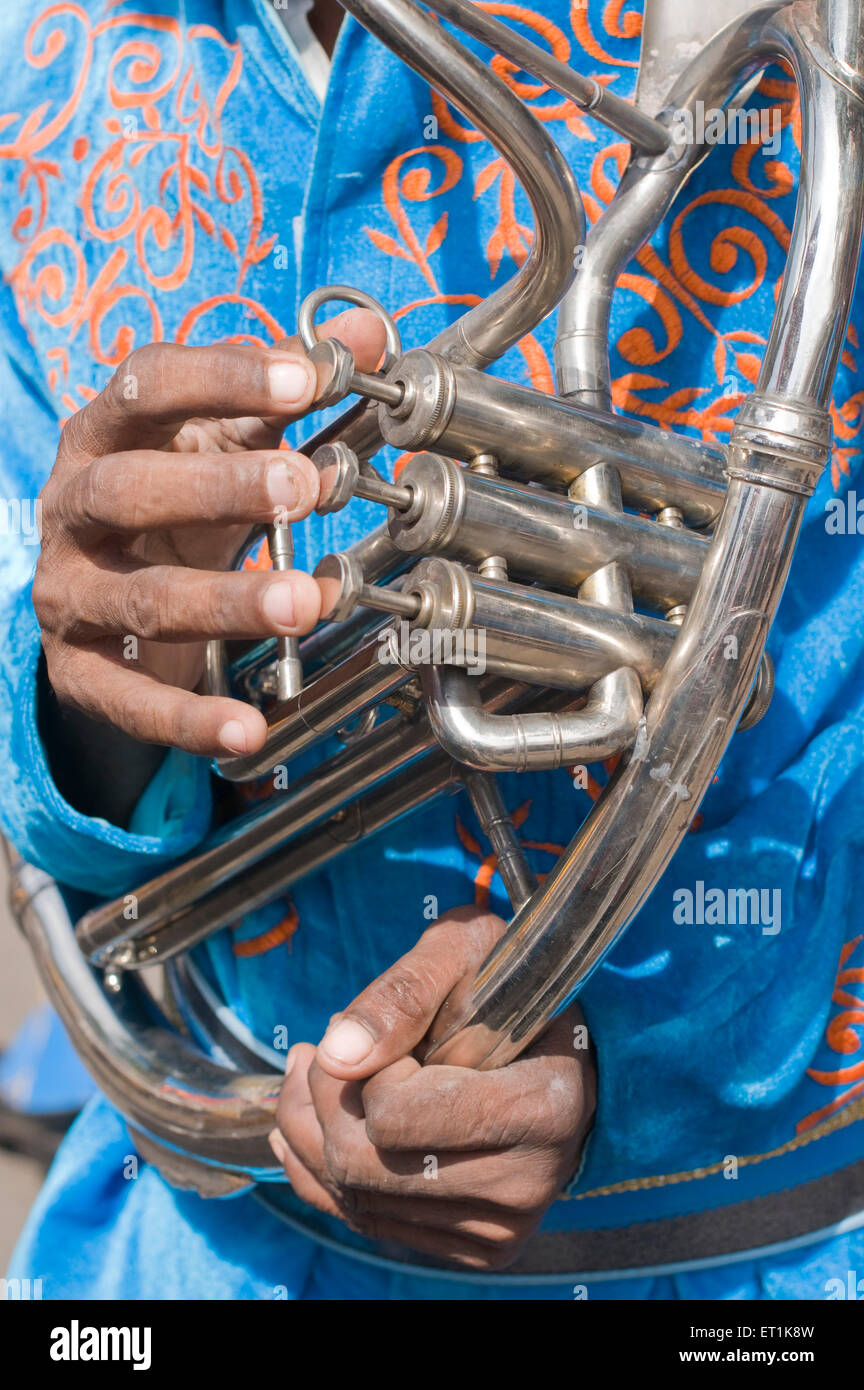Man playing the keys of musical instrument Pune Maharashtra India Asia Sept 2011 Stock Photo