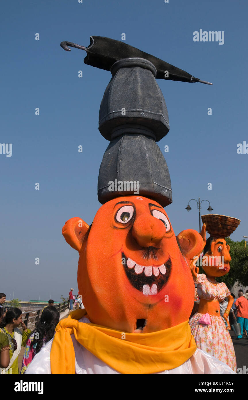 Effigy with two pots and umbrella parading Goa Maharashtra India Asia March 2011 Stock Photo