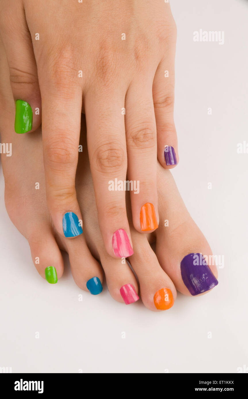 Different colours of nail polish on nails Pune Maharashtra India Asia May 2011 Stock Photo