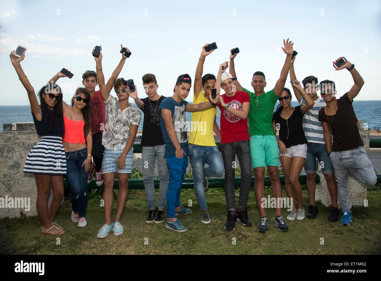 Group of young people having fun with mobile phones Stock Photo