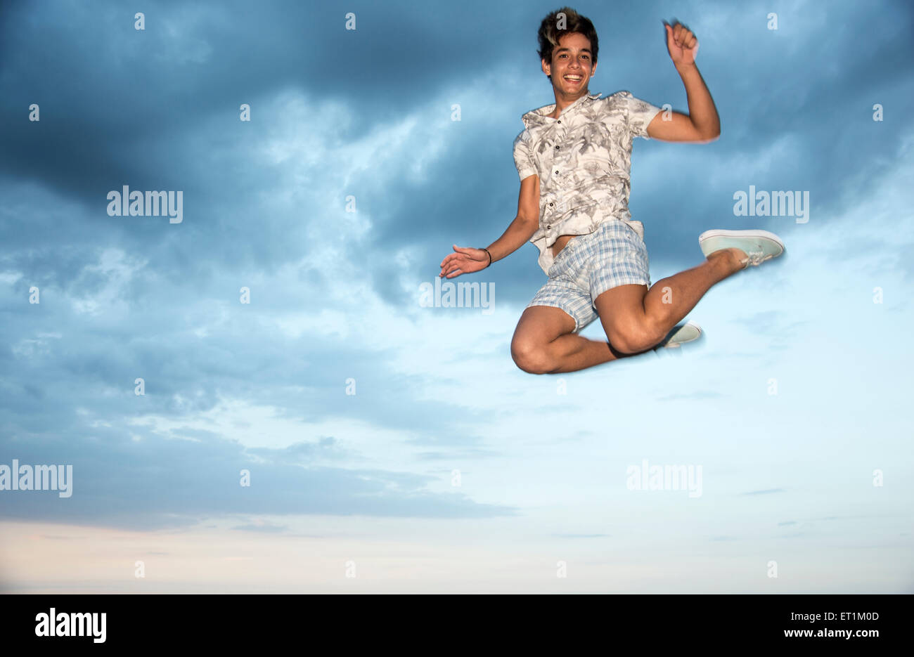 Young Latin man jumping Stock Photo Alamy