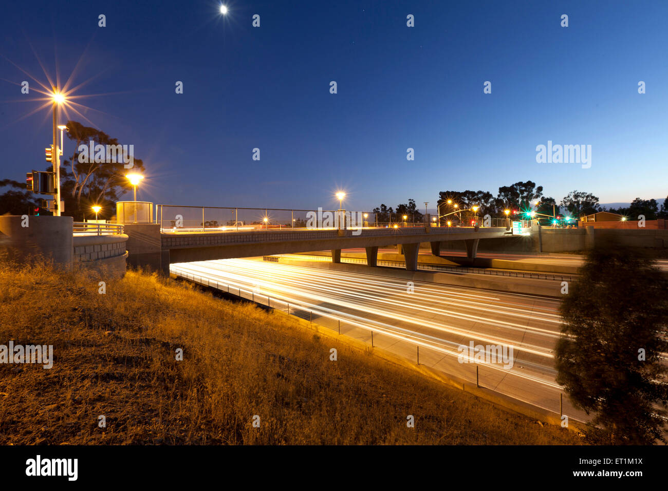 Freeway overpass at twilight Stock Photo