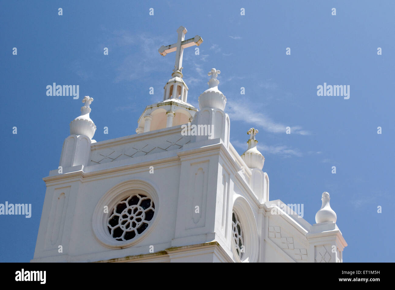 The National Shrine Basilica of Our Lady of Vallarpadam with a cross on top Stock Photo