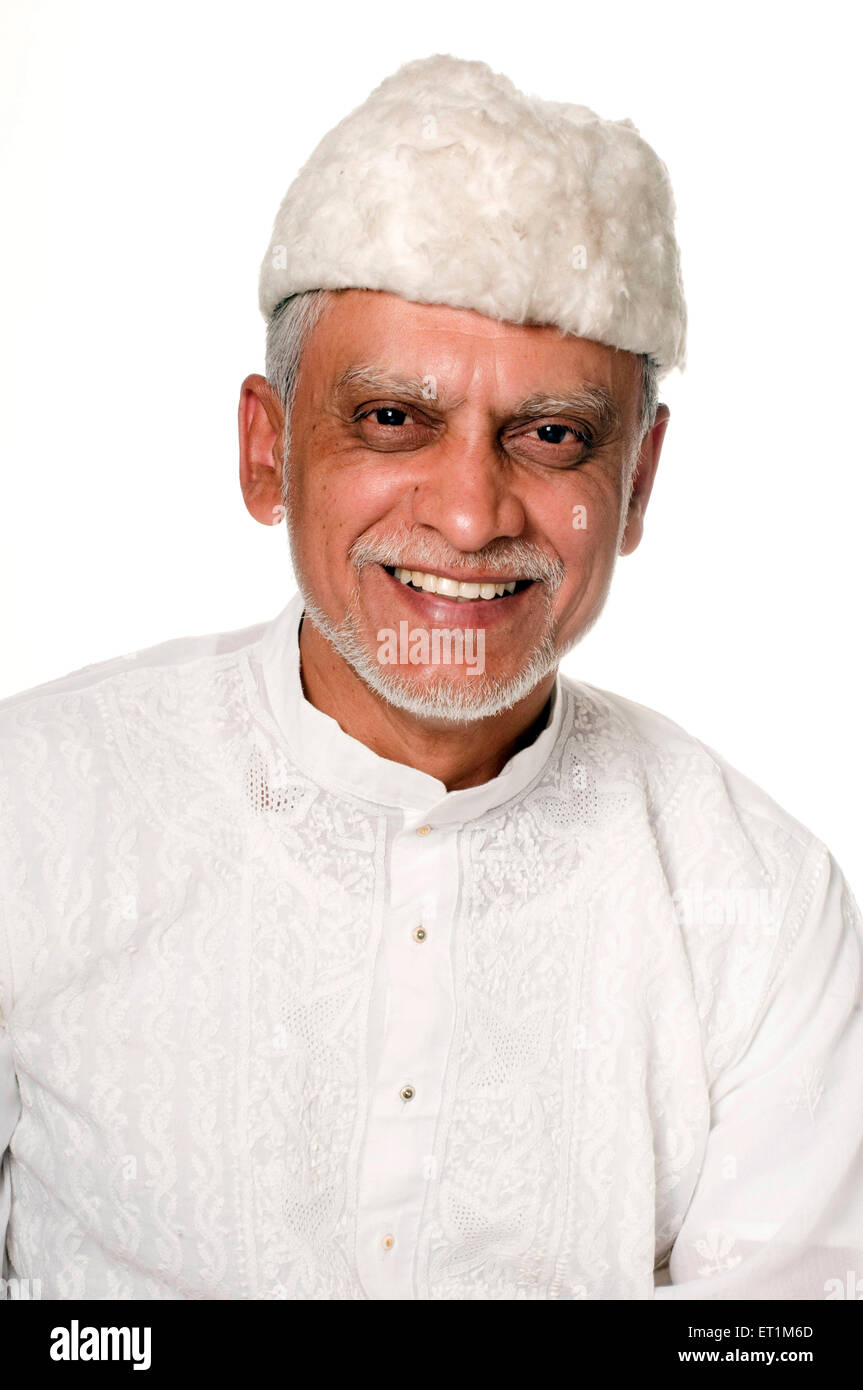 A portrait Maharashtrian elderly male wearing a white Kurta Pune Maharashtra India Asia MR # 686P Stock Photo